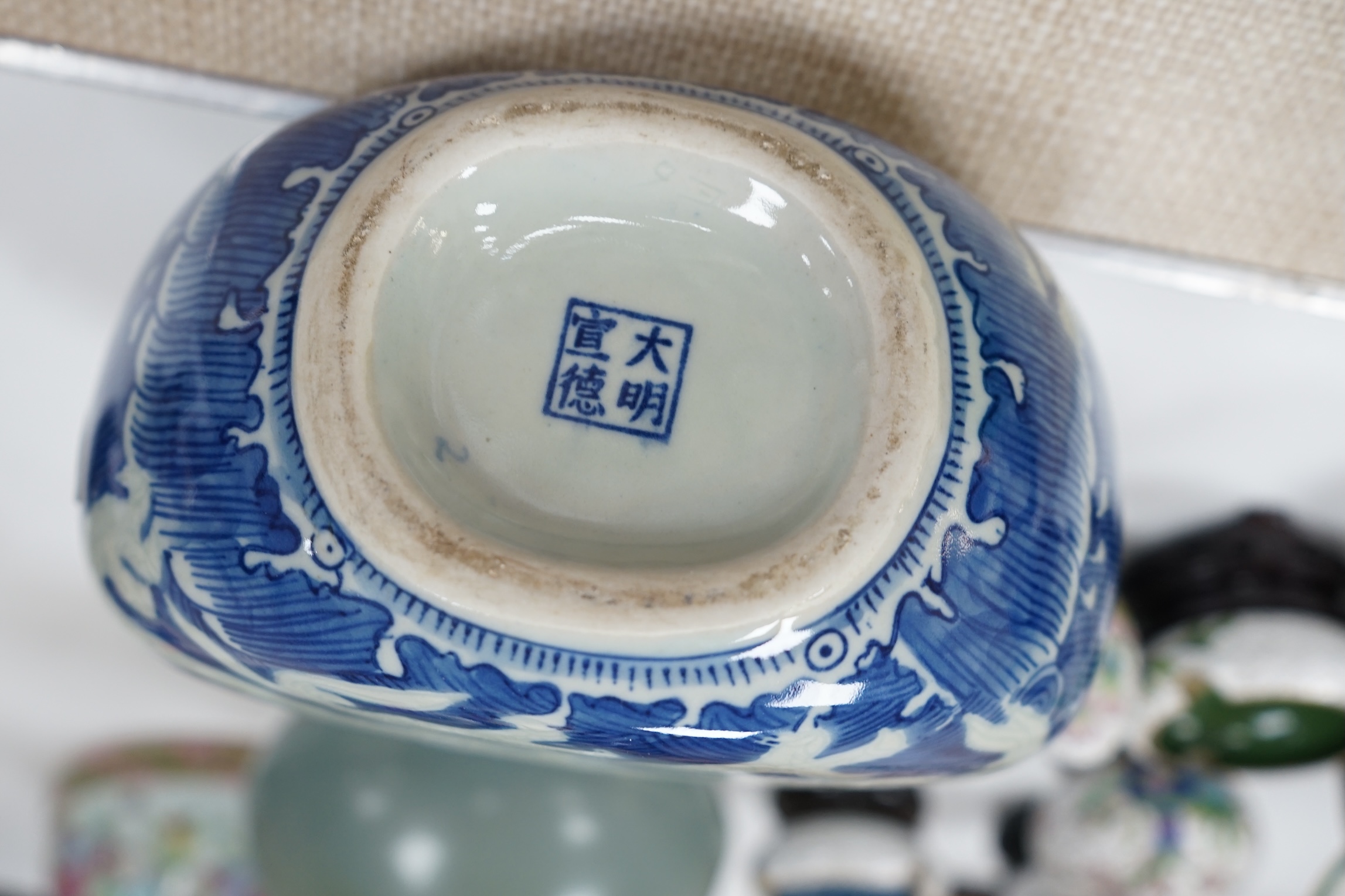 A large 19th century Chinese famille rose vase, a green glazed pear-shaped vase, and a blue and white dragon flask (3). Condition - poor to fair.